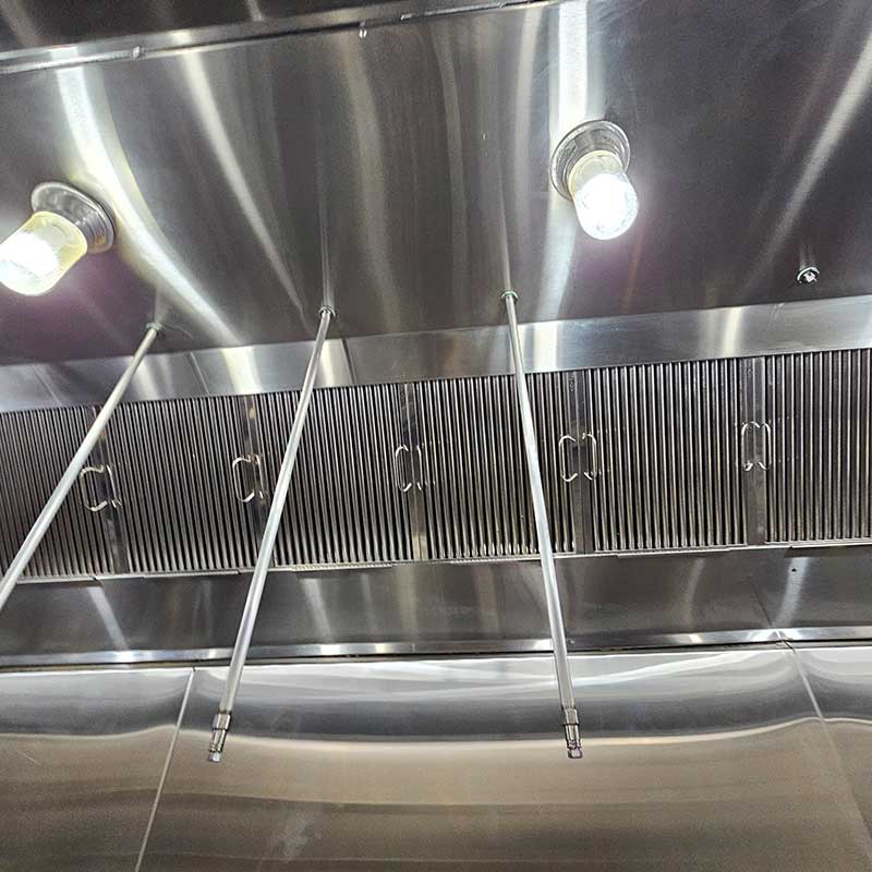 Expoline hood above stove with lightbulbs